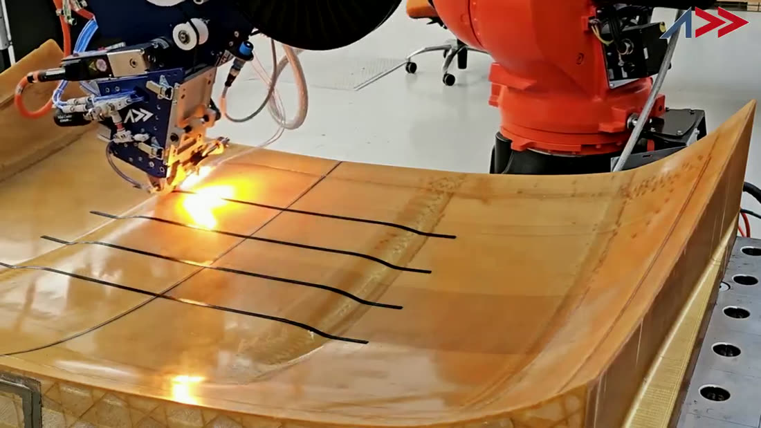 Real AddCell robot laying carbon fiber in a production cell