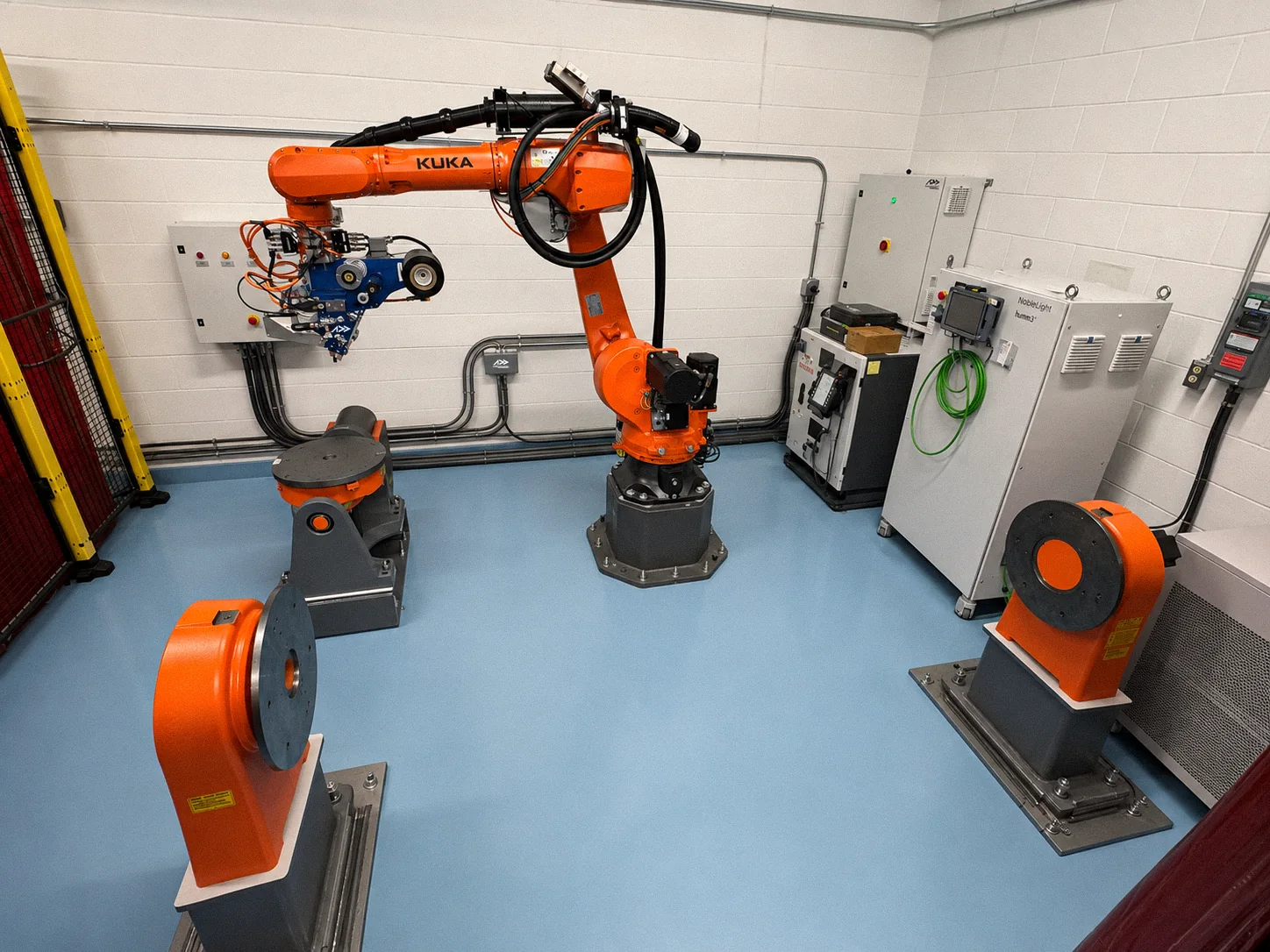 Complete AddCell robotic AFP cell with KUKA robot, three external positioners and integrated controls