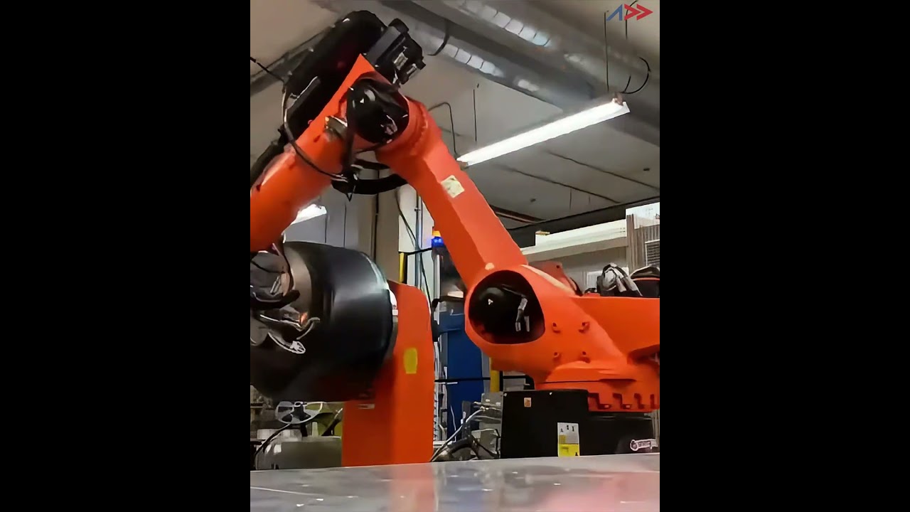 Robot-mounted AFP-XS producing a Type V composite tank